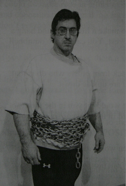 Brooks kubik with three eight-foot chains wrapped around his waist, circa 2006.