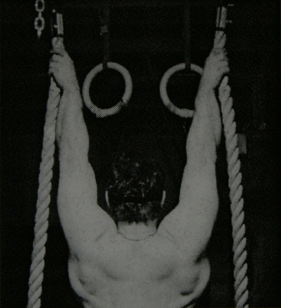 Brooks Kubik holding on to two Gorilla ropes with a reverse grip.