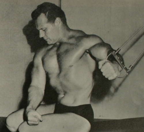John Grimek demonstrating a cable exercise for building the chest muscles.