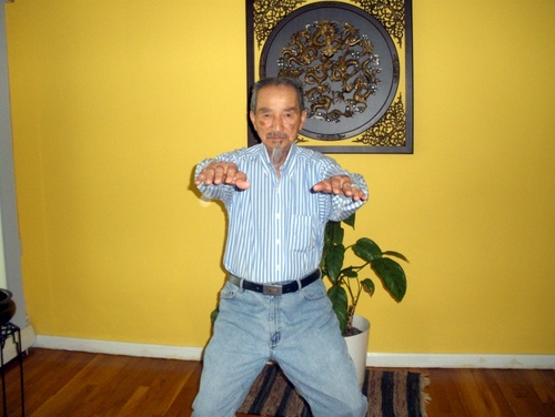 Sifu Share K. Lew in a horse-riding stance.