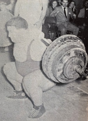 Paul Anderson performing a deep knee bend with a 660-pound barbell across his shoulders.